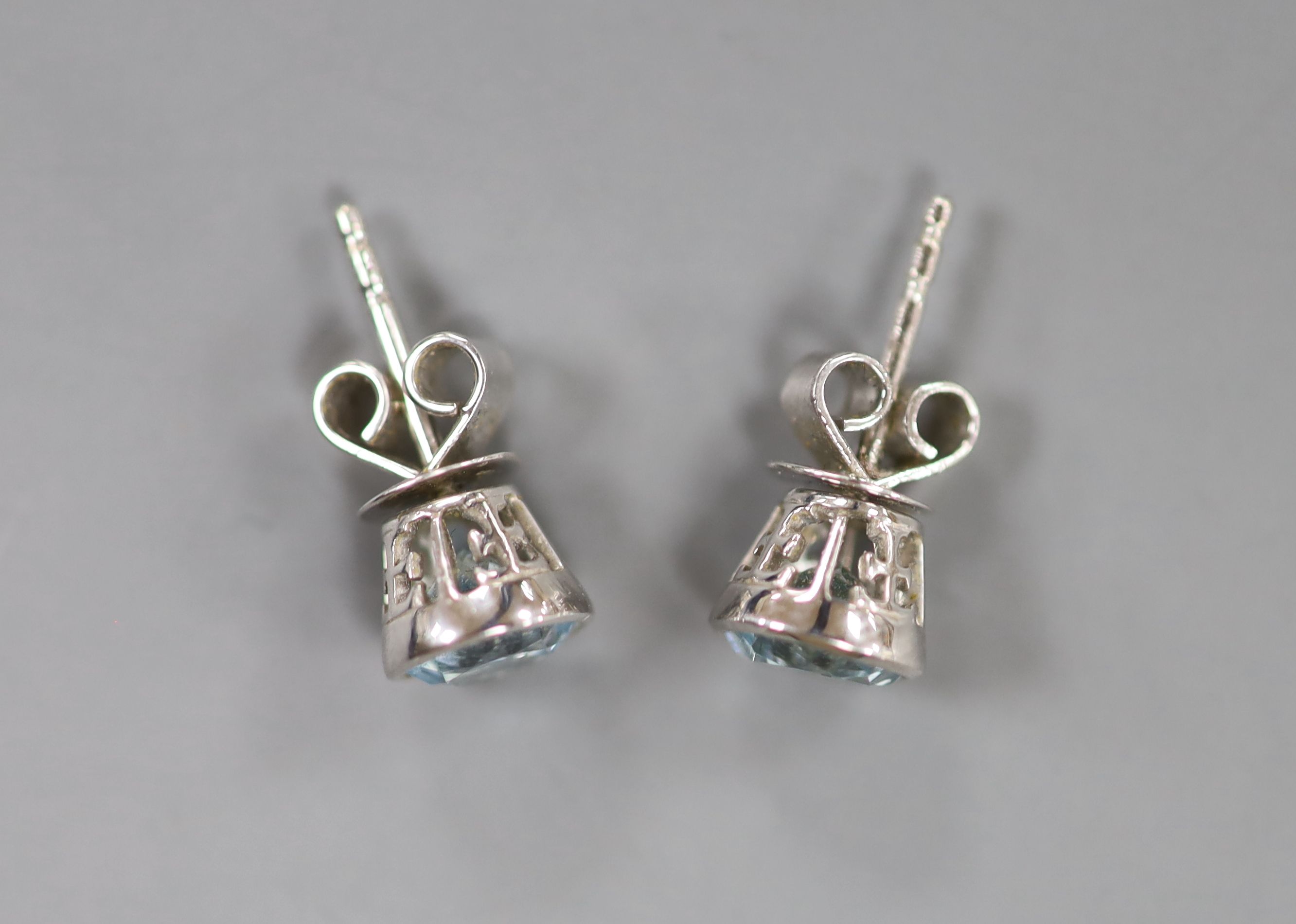 A cased modern pair of Theo Fennell 18ct white gold and blue topaz set ear studs